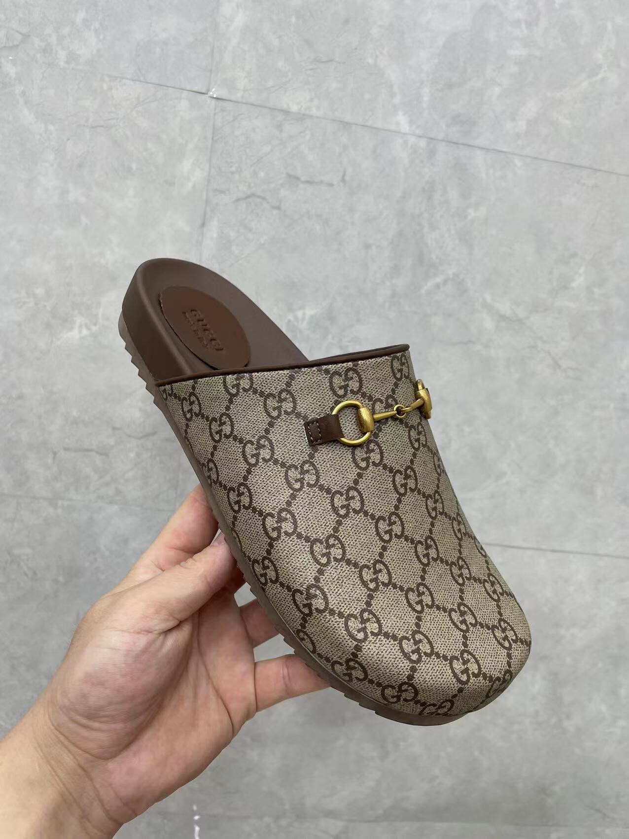 Gucci couple's matching slippers, the GG horsebit mules