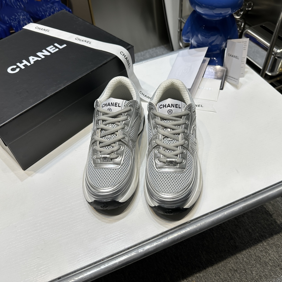 CHANEL Gold and silver horn king sneakers