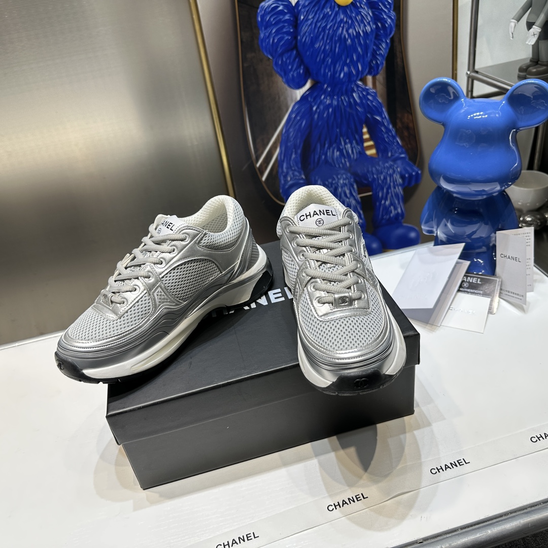 CHANEL Gold and silver horn king sneakers