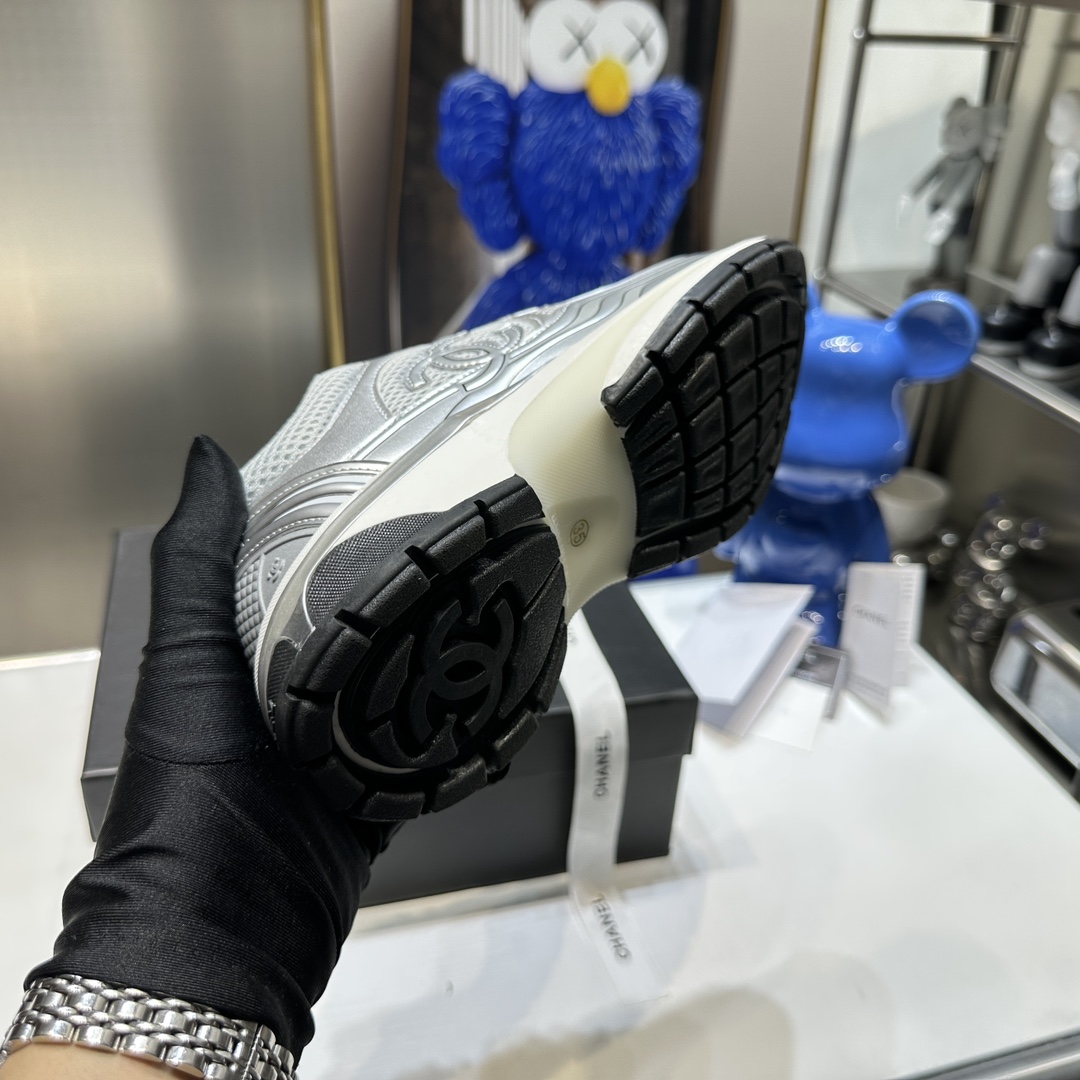 CHANEL Gold and silver horn king sneakers