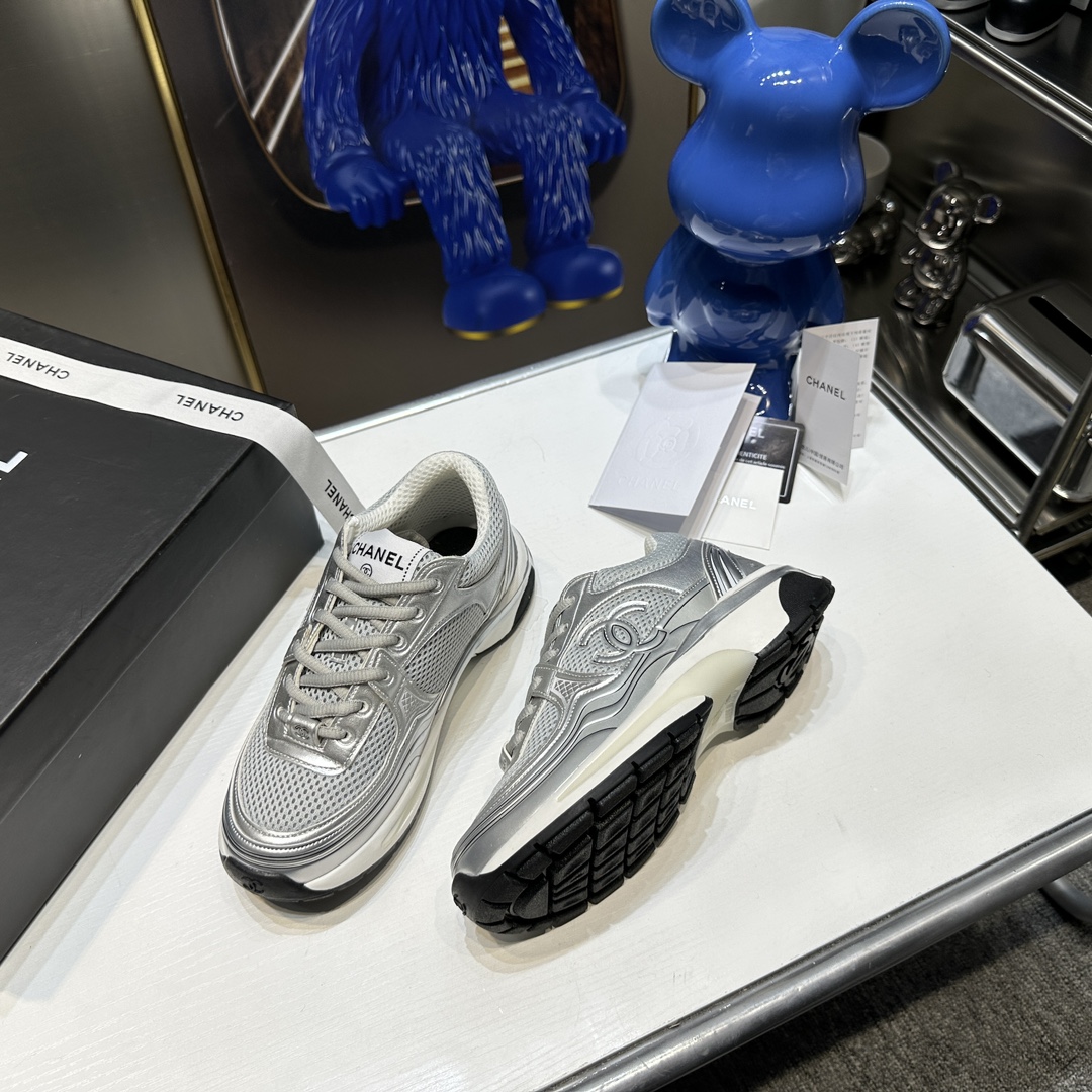 CHANEL Gold and silver horn king sneakers