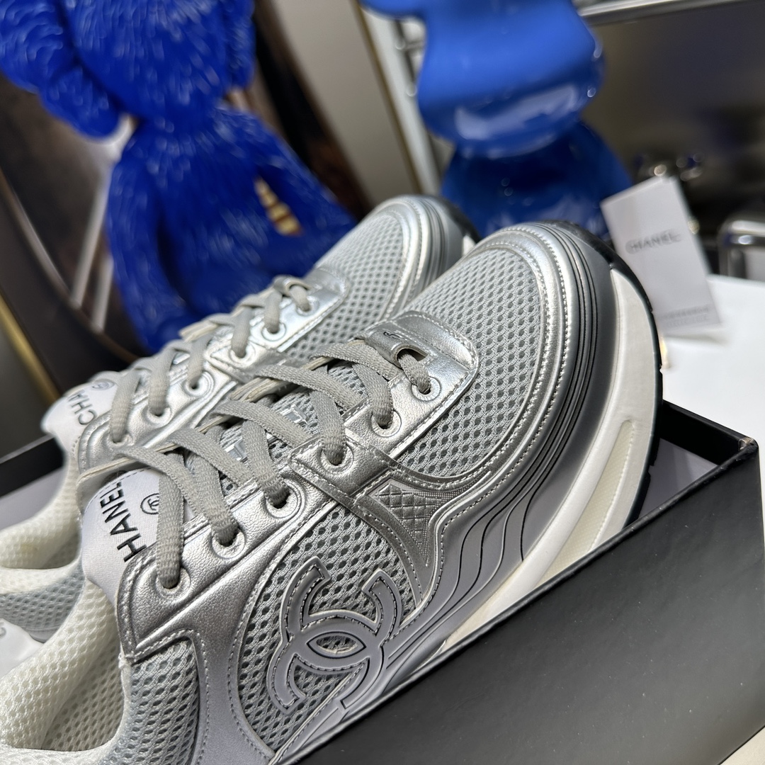 CHANEL Gold and silver horn king sneakers