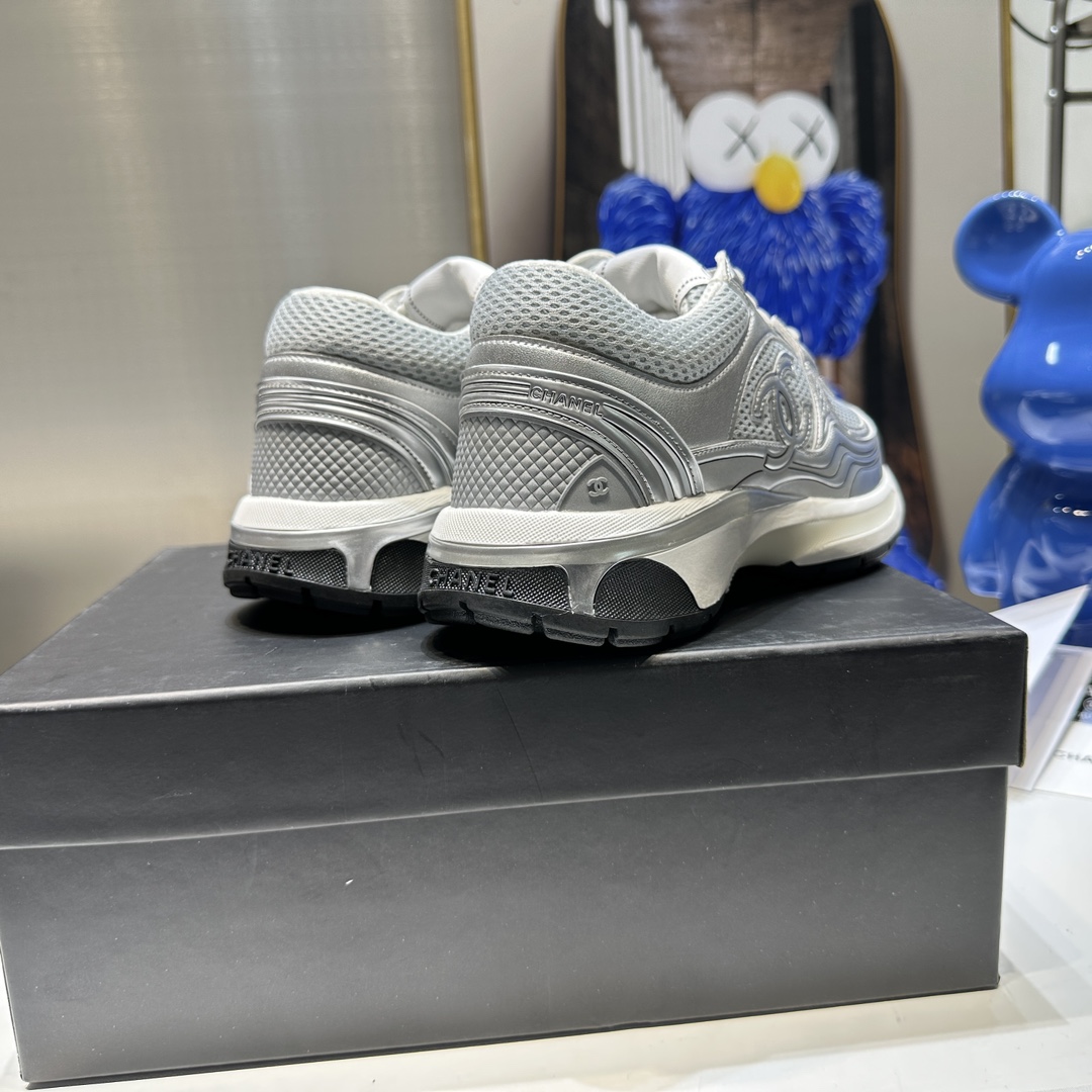 CHANEL Gold and silver horn king sneakers