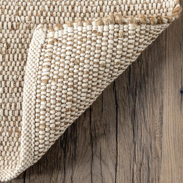 Elfriede Solid Jute Natural 9 ft. x 12 ft. Area Rug