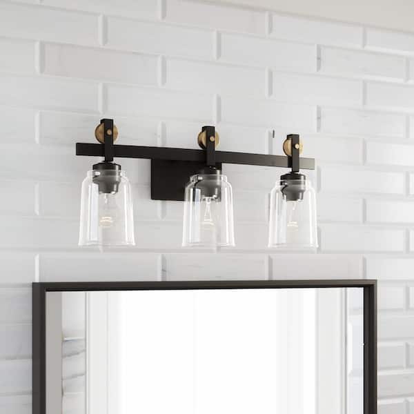 Knollwood 3-Light Antique Bronze Vanity Light with Vintage Brass Accents and Clear Glass Shades