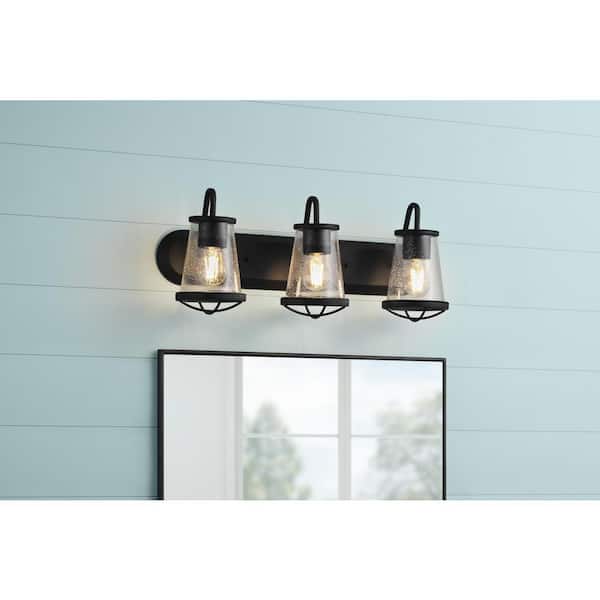 Georgina 24 in. 3-Light Matte Black Industrial Rustic Vanity with Clear Seeded Glass Shades and Cage Accents