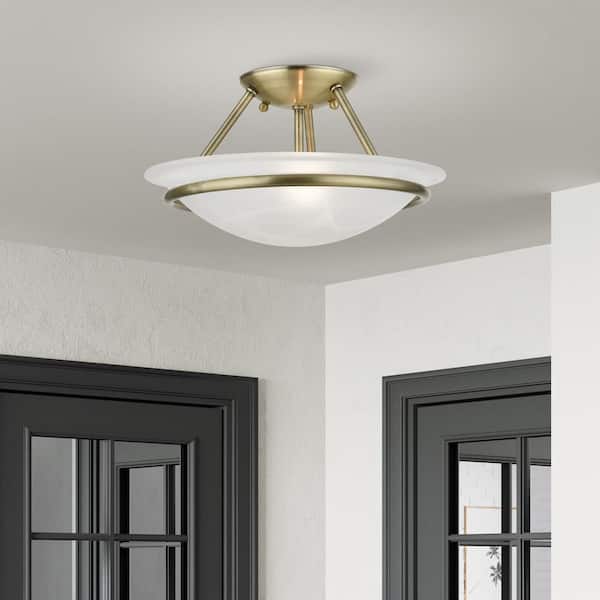 Newburgh 12 in. 2-Light Antique Brass Semi-Flush Mount with White Alabaster Glass