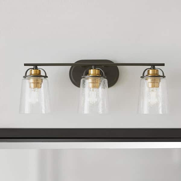 Goddard 23.1825 in. 3-Light Bronze with Vintage Brass Industrial Bathroom Vanity Light Accents and Clear Seeded Glass