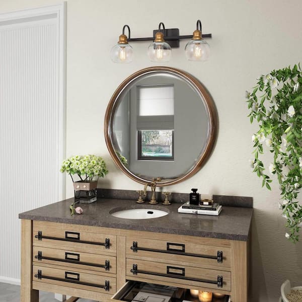 22 in. 3-Light Modern Aged Brass and Black Bathroom Vanity Light with Clear Glass Globe Shades