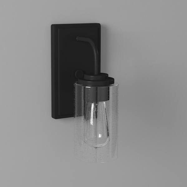 Logan 4.5 in. 1-Light Matte Black Modern Transitional Wall Sconce with Clear Seedy Glass Shade