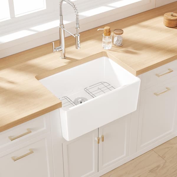 Denbigh Crisp White Ceramic 24 in. Single Bowl Farmhouse Apron Kitchen Sink with Bottom Grid and Basket Strainer