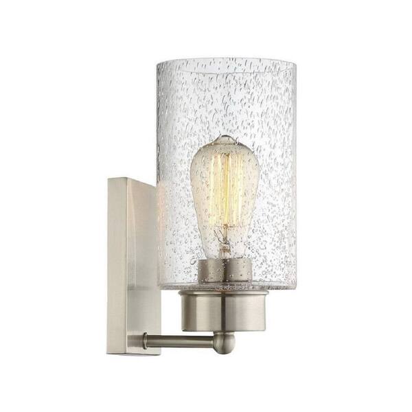 Meridian 5 in. W x 10.5 in. H 1-Light Brushed Nickel Wall Sconce with Clear Seeded Glass Shade