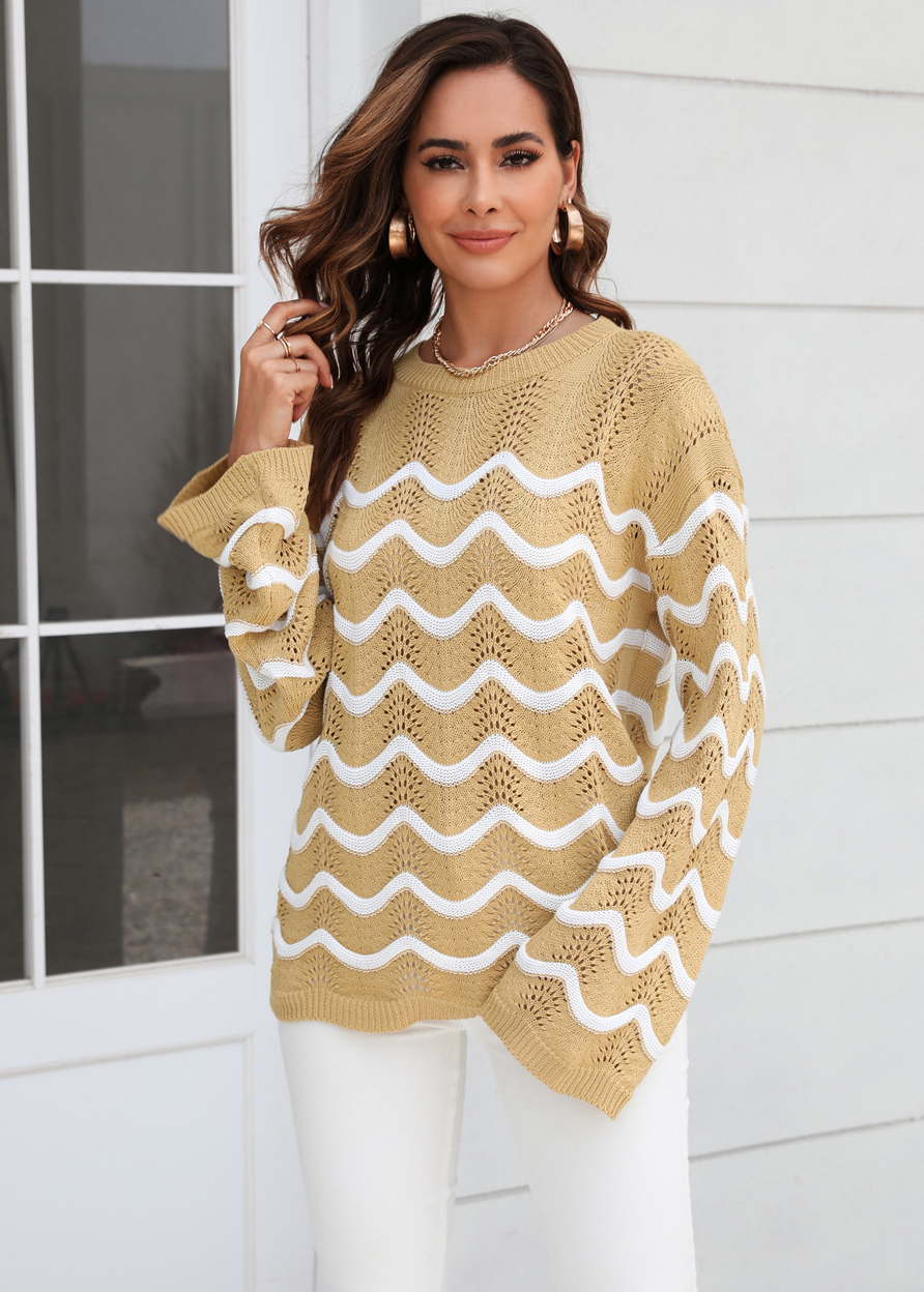 Women knitting long sleeve striped cutout sweater