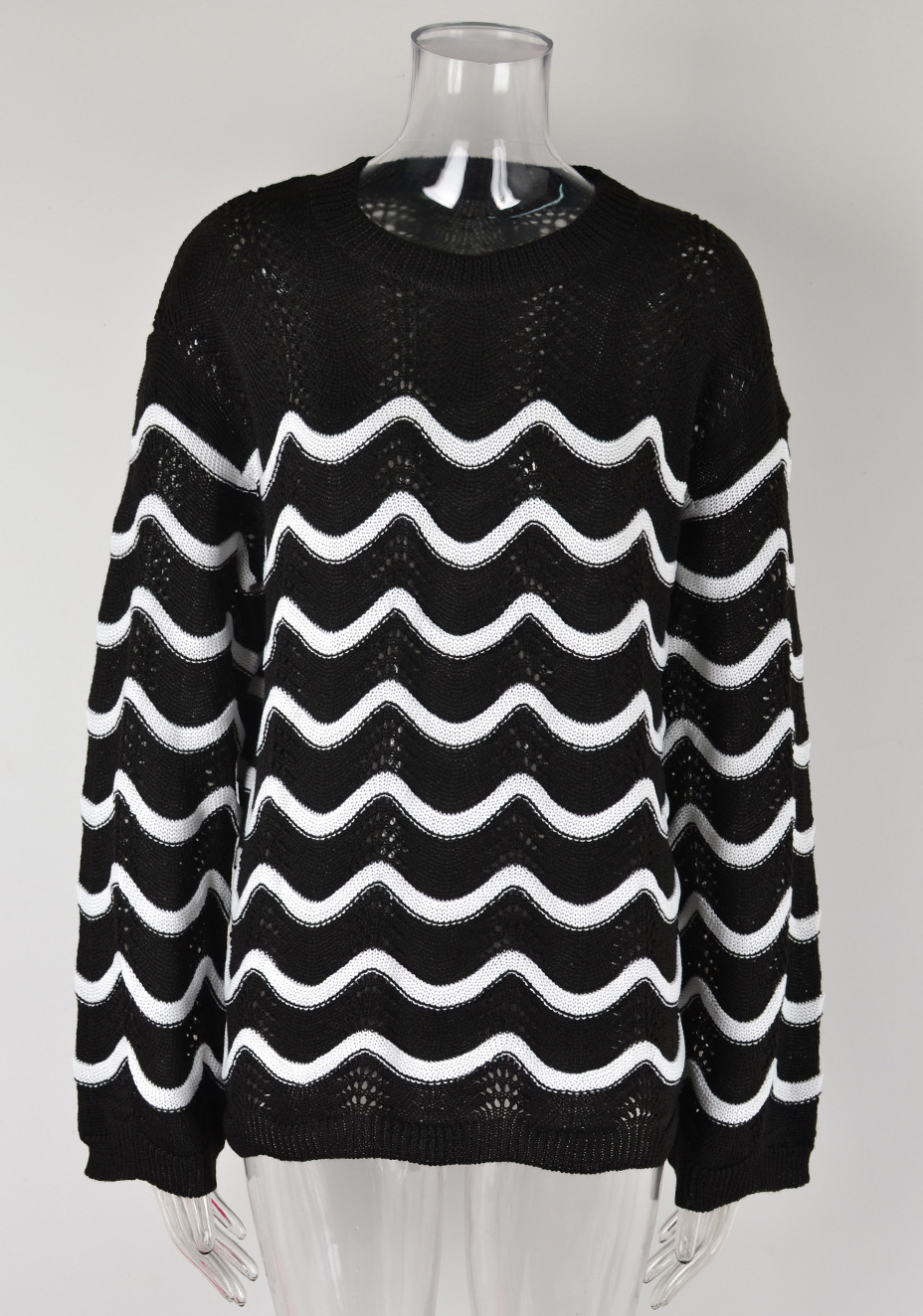 Women knitting long sleeve striped cutout sweater