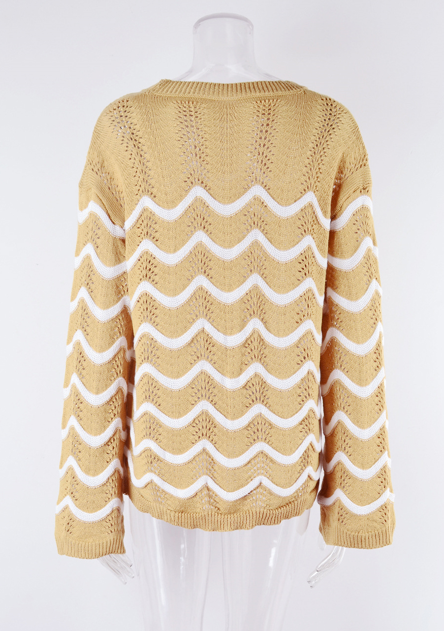 Women knitting long sleeve striped cutout sweater