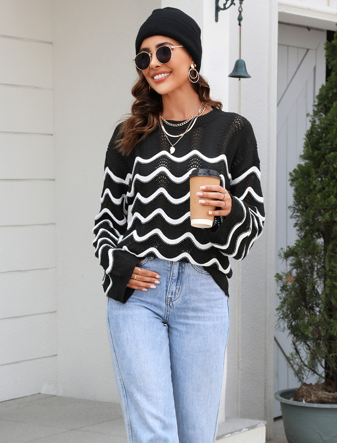 Women knitting long sleeve striped cutout sweater