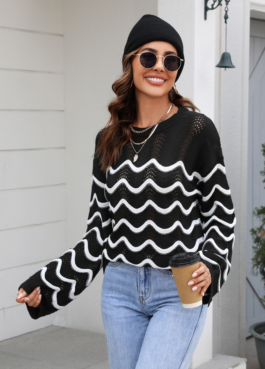 Women knitting long sleeve striped cutout sweater