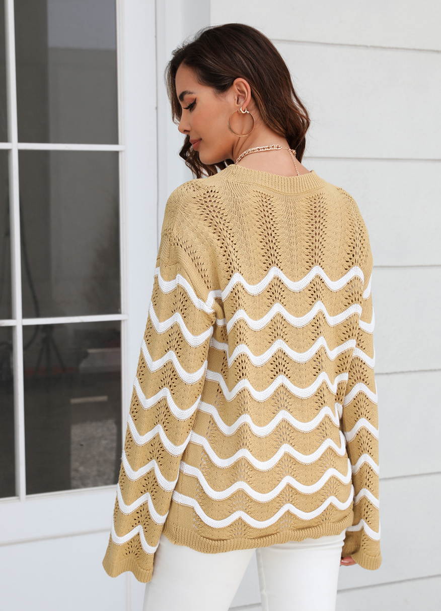 Women knitting long sleeve striped cutout sweater