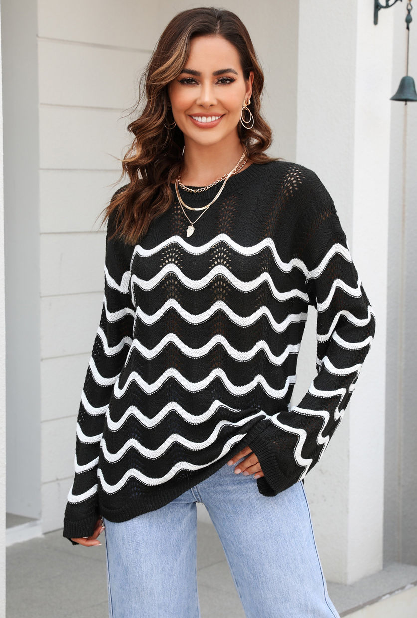 Women knitting long sleeve striped cutout sweater
